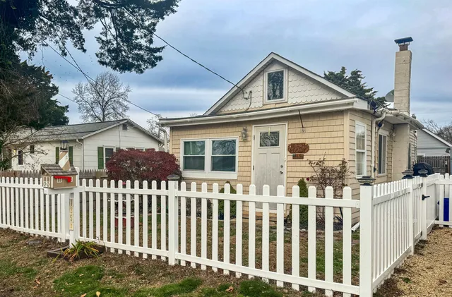a front view of a house with a small yard