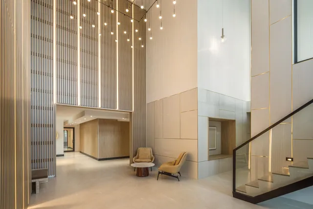 a view of a hallway with seating area