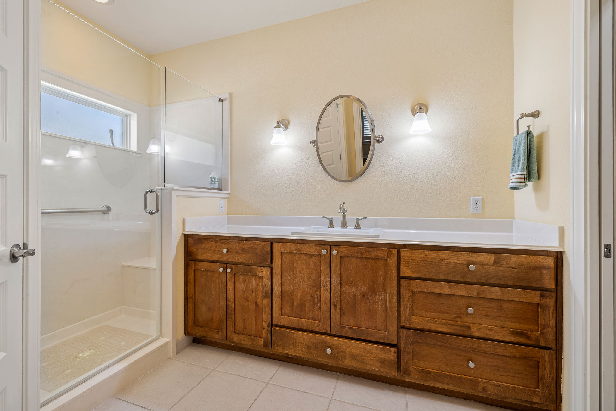 5201 Big Spring Street Georgetown, TX 78633 - Photo 15 of 26 Bathroom featuring vanity, a shower stall, and light tile patterned floors
