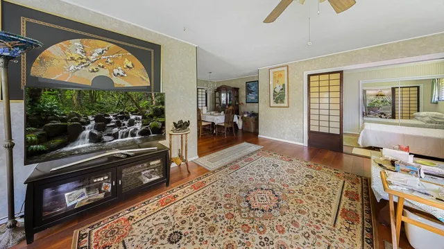 a living room with furniture and a flat screen tv