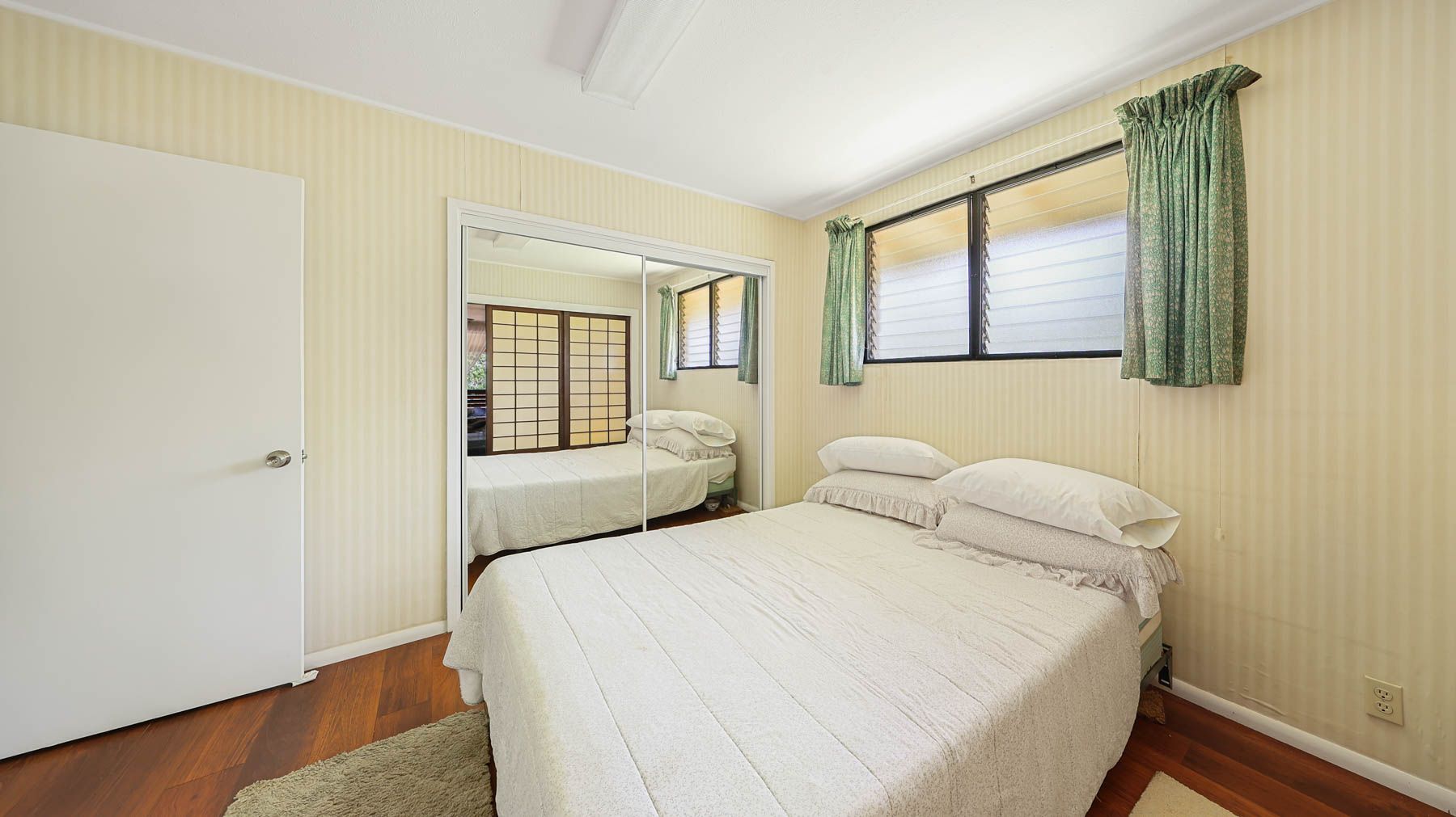 6033 Puka Street Kapaa, HI 96746 - Photo 8 of 23 a bedroom with a bed and a window