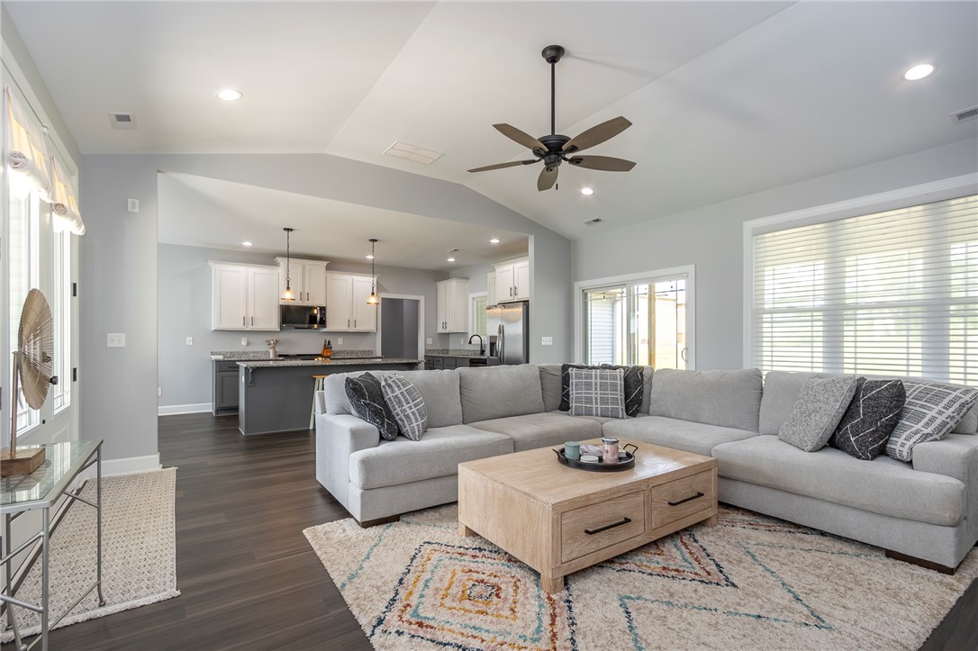 3080 McGee Road Iva, SC 29655 - Photo 12 of 49 An open concept living area connects seamlessly with a modern kitchen, ideal for entertaining.