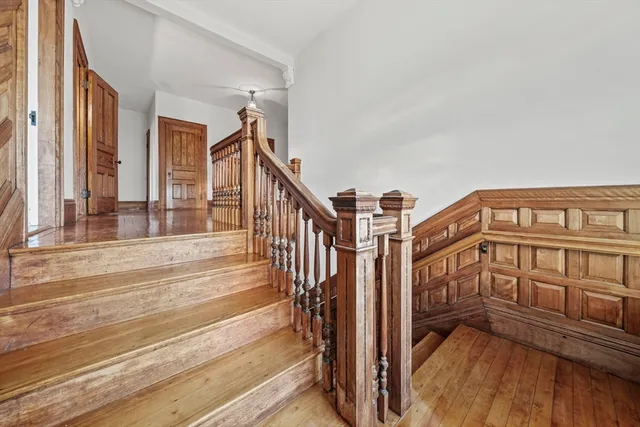 a view of an entryway with wooden floor