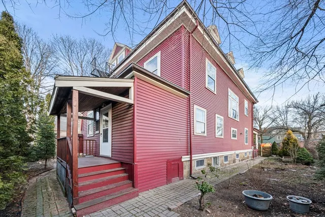 a front view of a house with a street