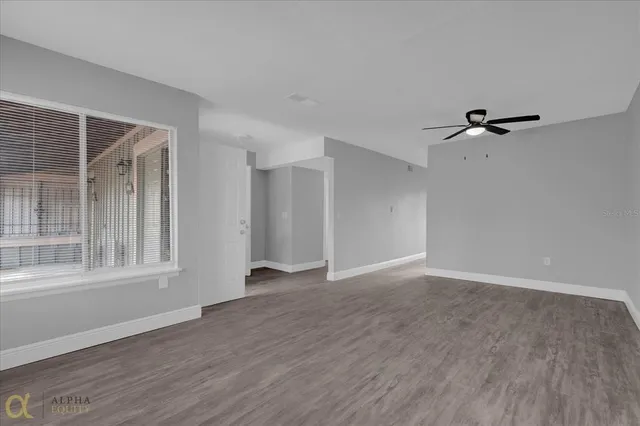 a view of an empty room with a window