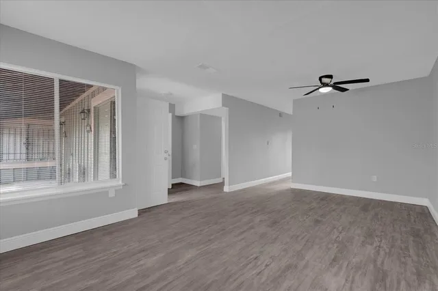 a view of an empty room with a window