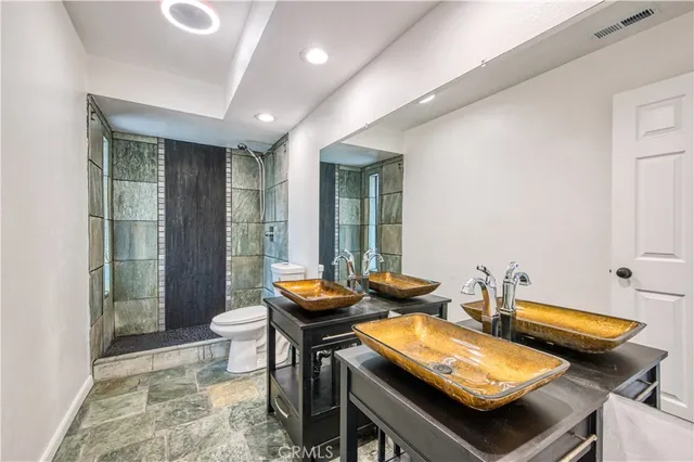 a dining room with furniture and a floor to ceiling window