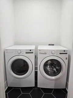 a utility room with dryer and washer