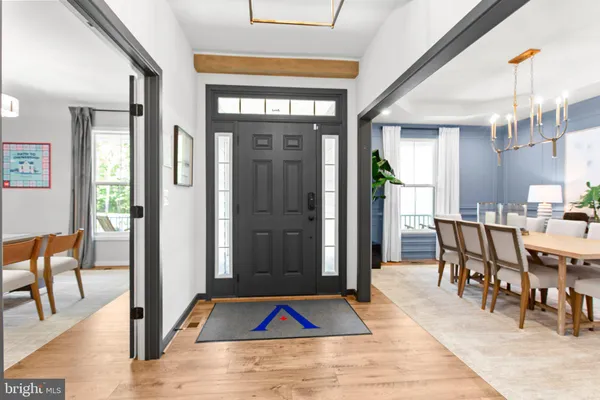 a view of livingroom with dining room and hardwood floor
