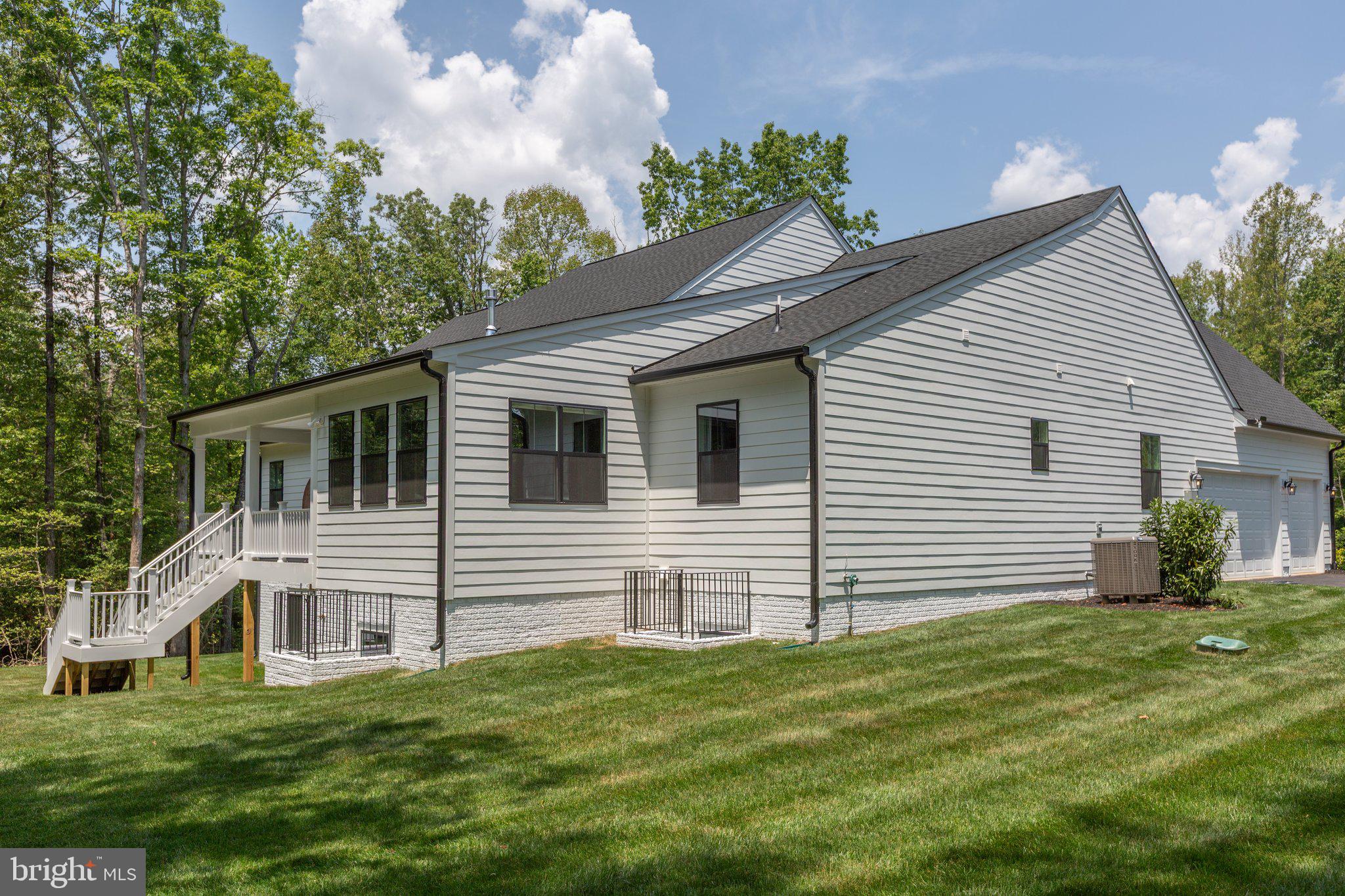4 Zoar Road Locust Grove, VA 22508 - Photo 26 of 32 a front view of a house with a garden