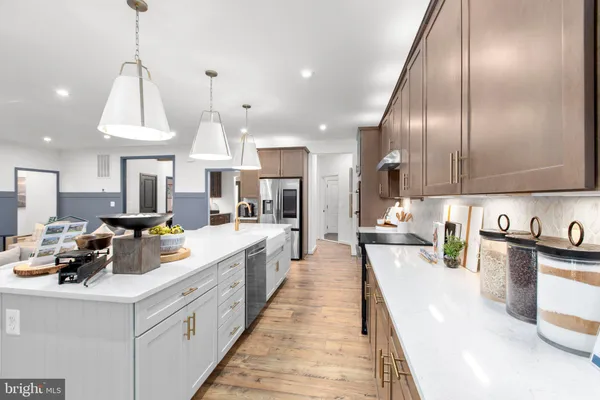a kitchen with stainless steel appliances granite countertop lots of counter top space