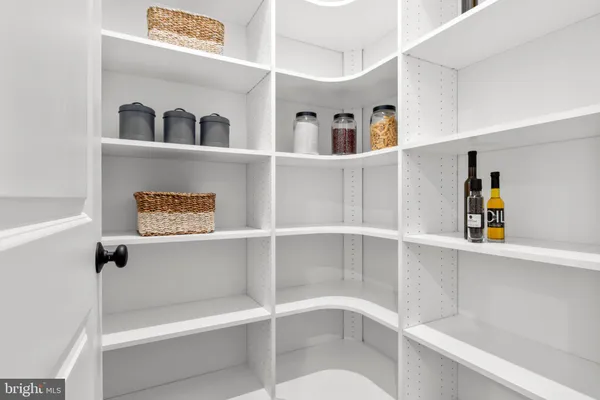 a view of a closet with a book shelf