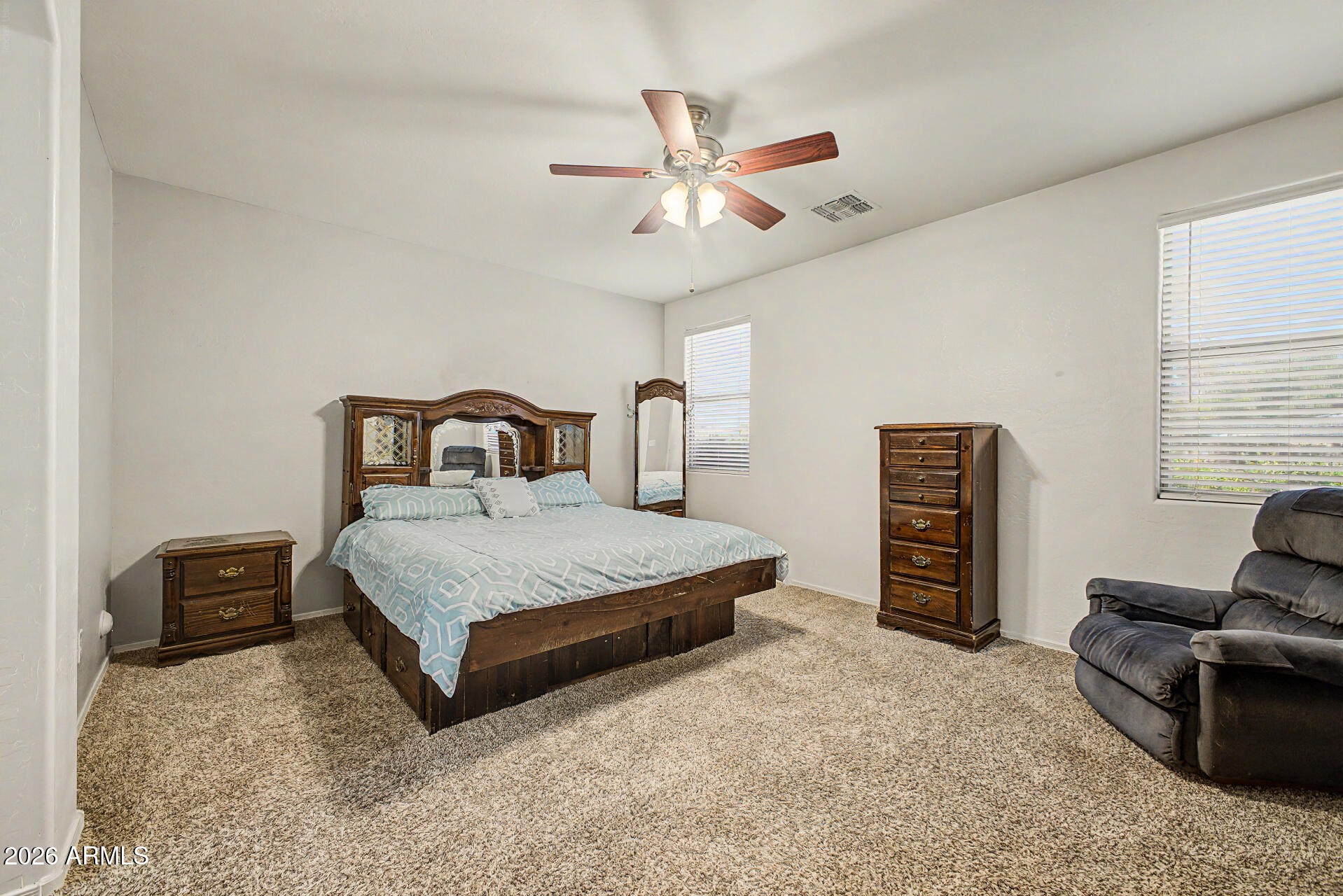 6622 West Harwell Road Laveen, AZ 85339 - Photo 16 of 32 a bedroom with a bed dresser and a window