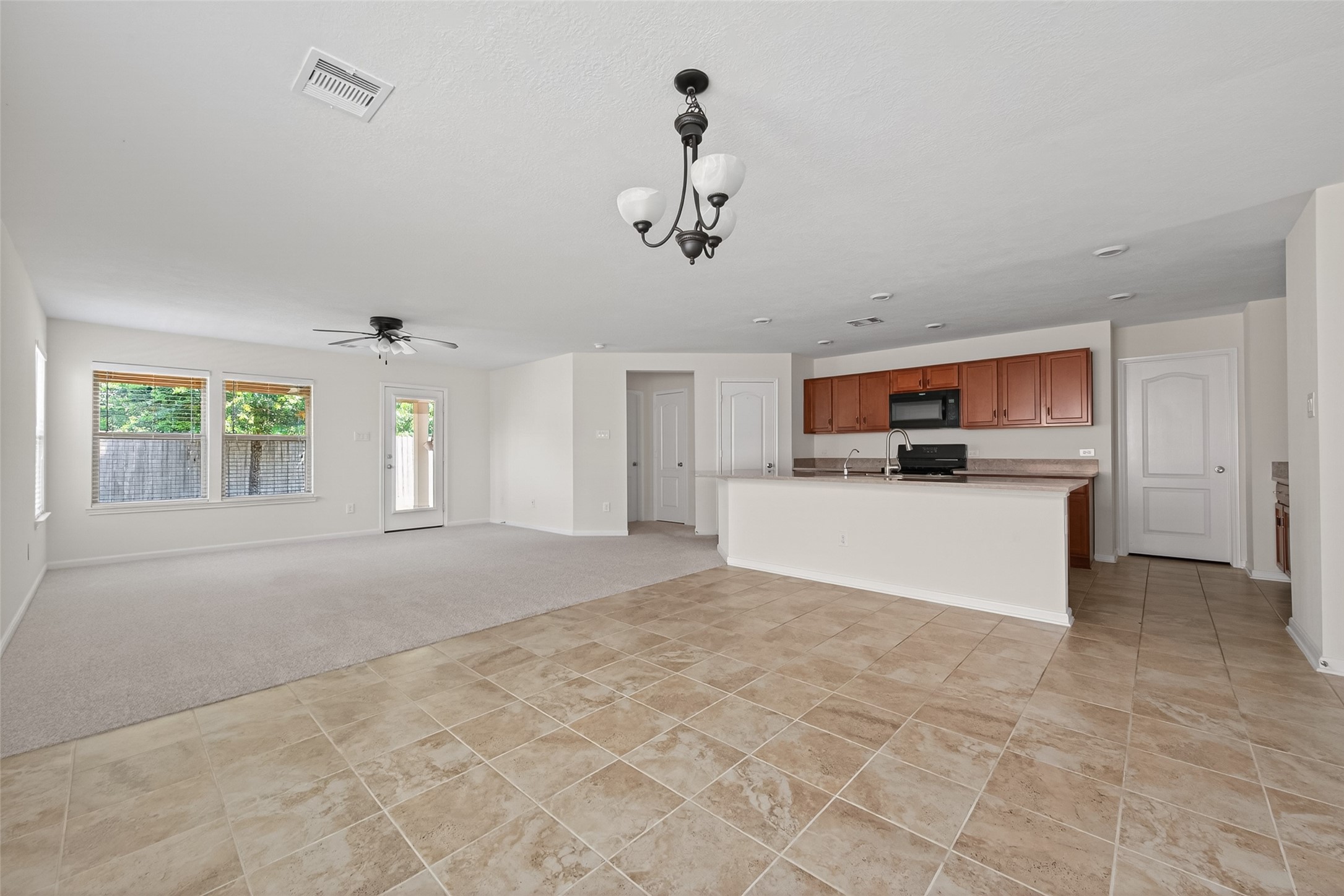 2754 Cayden Creek Way Conroe, TX 77304 - Photo 6 of 40 a view of kitchen with stainless steel appliances cabinets and window
