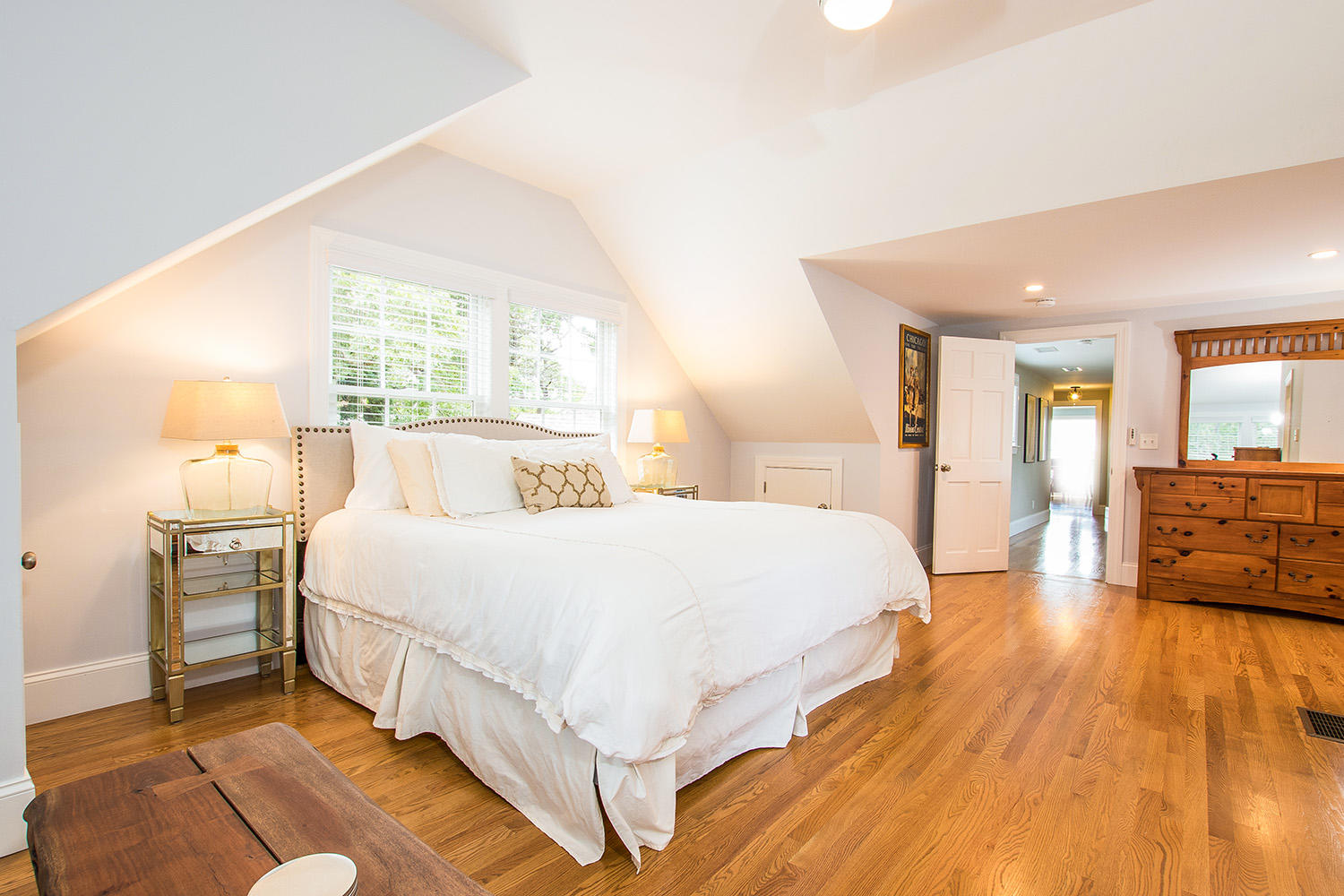 107 Captains Walk Chatham, MA 02650 - Photo 36 of 51 a spacious bedroom with a bed and wooden floor
