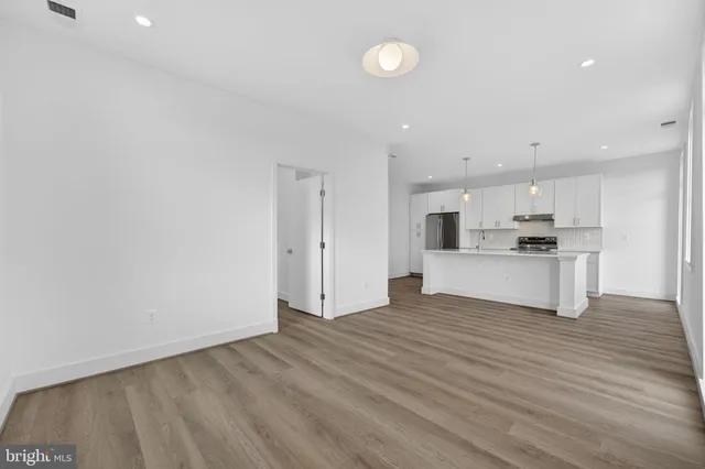 a view of kitchen with wooden floor and window