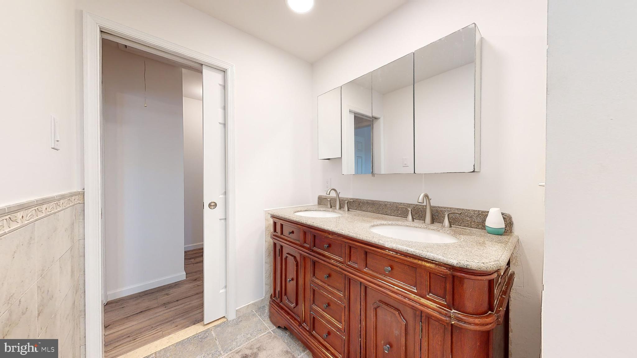 49 Eaves Mill Road Medford, NJ 08055 - Photo 17 of 38 a bathroom with a sink and a mirror