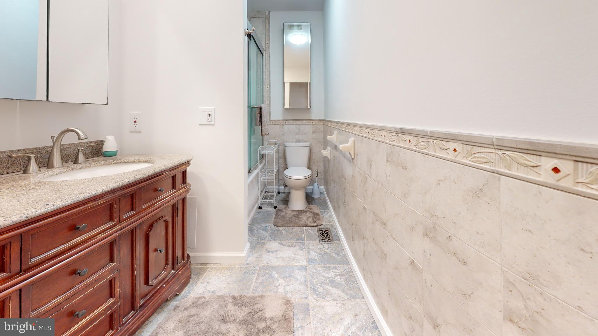 49 Eaves Mill Road Medford, NJ 08055 - Photo 35 of 38 a bathroom with a sink a toilet and a mirror