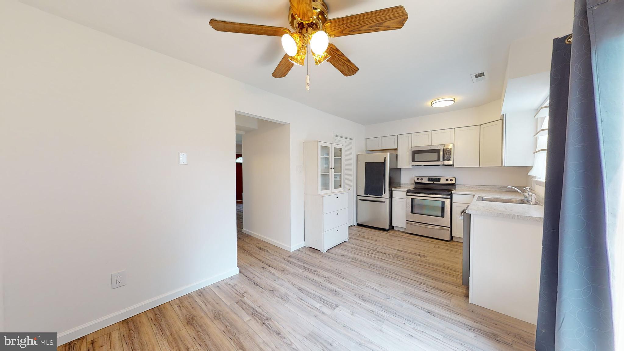 49 Eaves Mill Road Medford, NJ 08055 - Photo 4 of 38 a view of kitchen with stainless steel appliances wooden floor