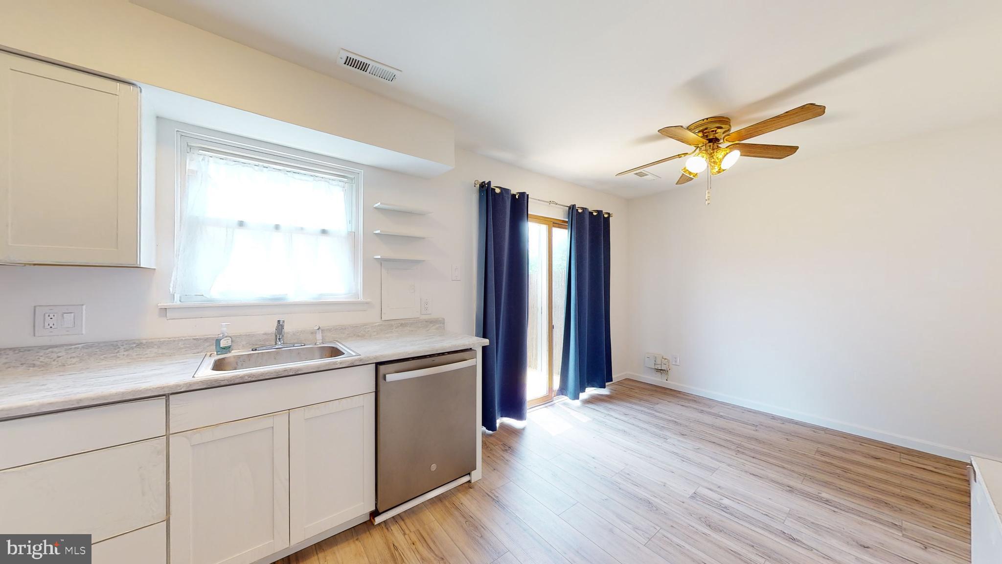 49 Eaves Mill Road Medford, NJ 08055 - Photo 6 of 38 a kitchen with a sink cabinets and wooden floor