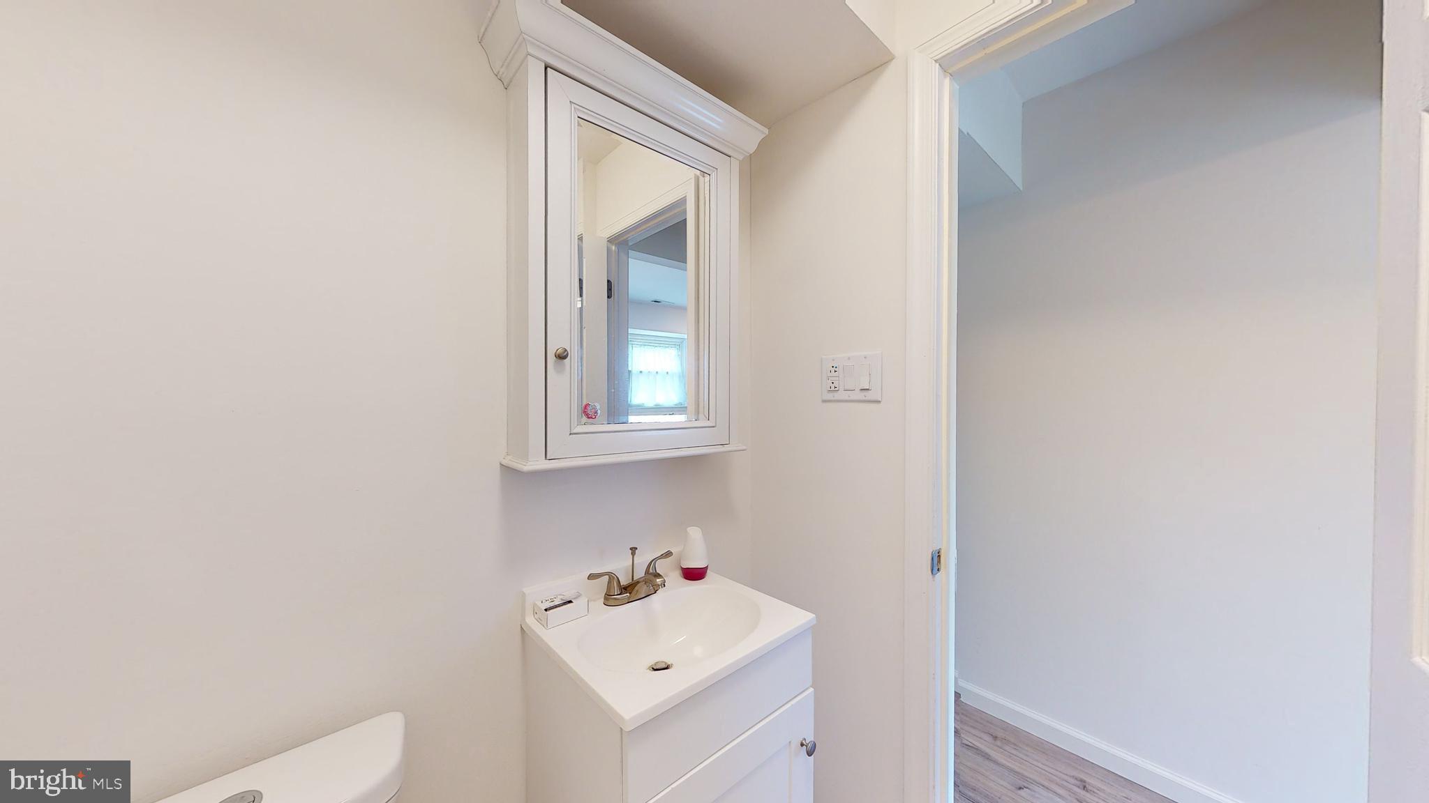 49 Eaves Mill Road Medford, NJ 08055 - Photo 8 of 38 a bathroom with a sink and a window