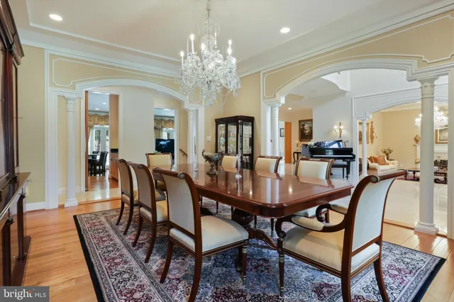 a kitchen with counter top space and living room view