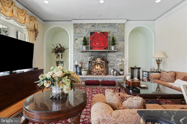 a bedroom with a bed gym equipment and a large window
