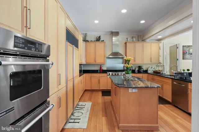 a white bath tub sitting in a bathroom next to a window