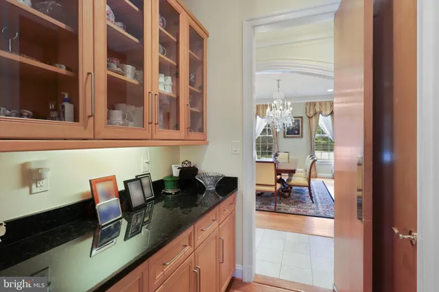 a bathroom with a sink mirror and a bath tub