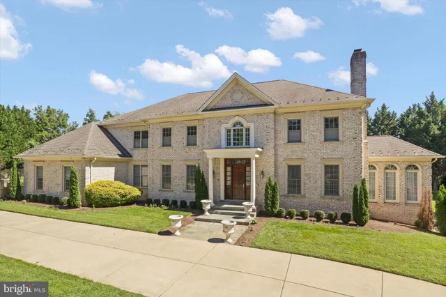 a spacious bathroom with a granite countertop sink a toilet and shower