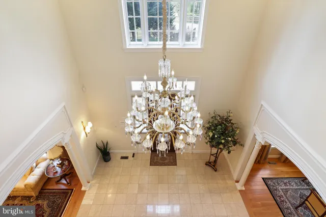 a front view of a house with swimming pool having outdoor seating