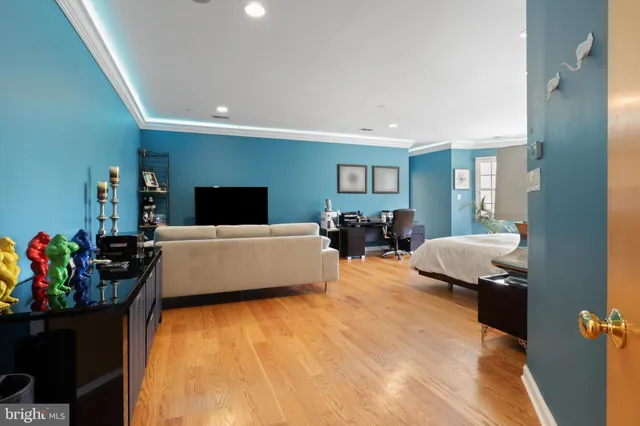 a front view of a house with a yard and potted plants