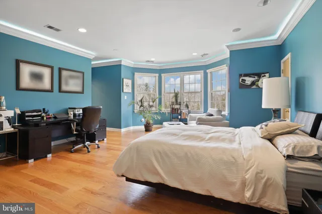a view of a patio with table and chairs under an umbrella