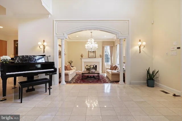 a view of a house with potted plants and couches