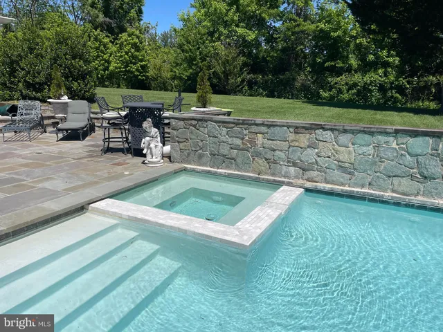 a view of a livingroom with furniture and a table wooden floor