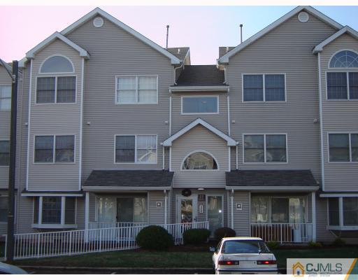1224 Edpas Road New Brunswick, NJ 08901 - Photo 2 of 6 a front view of a residential apartment building with windows