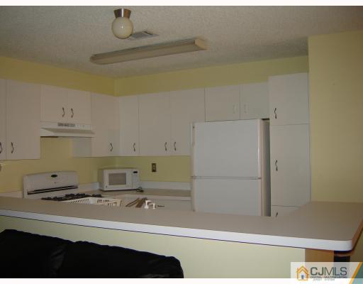 1224 Edpas Road New Brunswick, NJ 08901 - Photo 4 of 6 a kitchen with a sink and cabinets