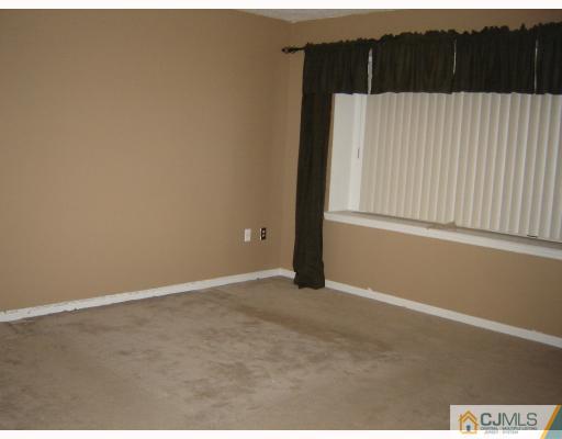 1224 Edpas Road New Brunswick, NJ 08901 - Photo 5 of 6 an empty room with wooden floor