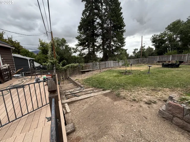 a backyard of a house with lots of green space