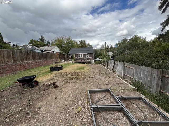 a view of a backyard with sitting area