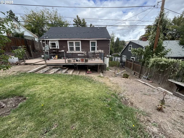 a room with furniture and a view of kitchen