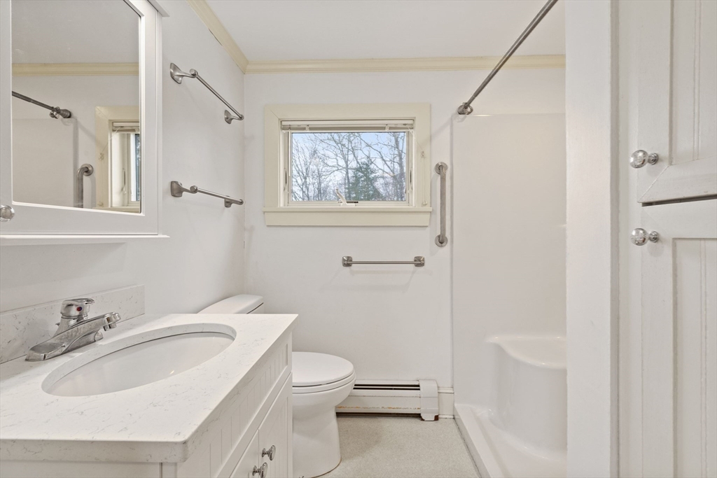 66 Converse Road Marion, MA 02738 - Photo 15 of 22 a bathroom with a sink a toilet and a mirror