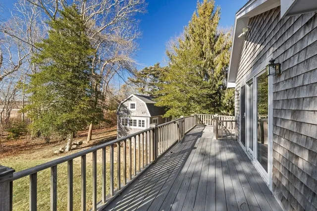 a view of a balcony with wooden floor