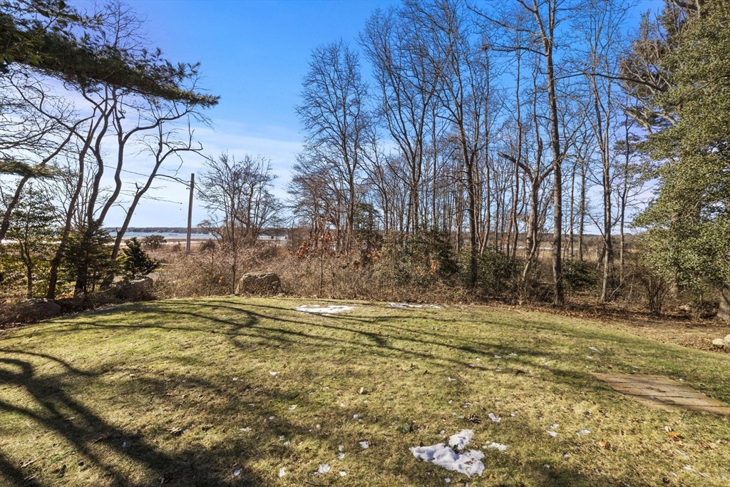 66 Converse Road Marion, MA 02738 - Photo 20 of 22 a view of a yard with a house