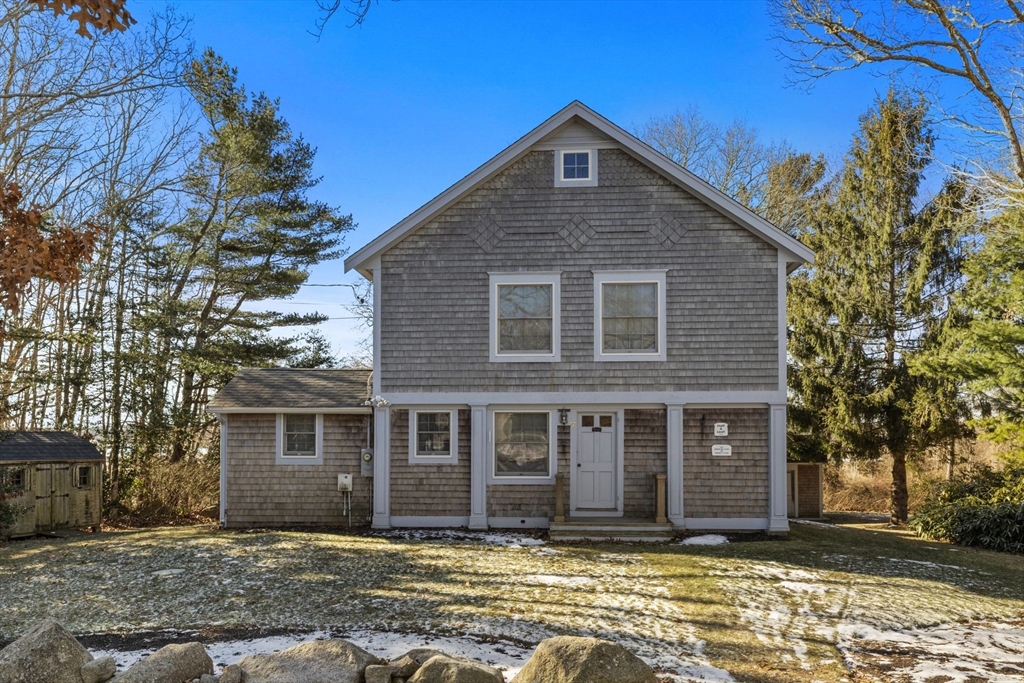 66 Converse Road Marion, MA 02738 - Photo 2 of 22 a front view of a house with a yard