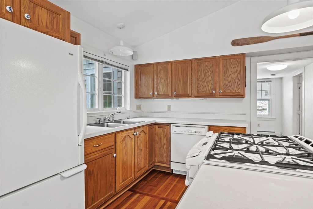 66 Converse Road Marion, MA 02738 - Photo 6 of 22 a kitchen with stainless steel appliances a sink stove and cabinets