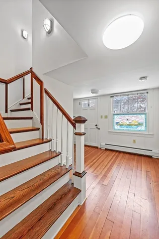 a view of entryway with wooden floor