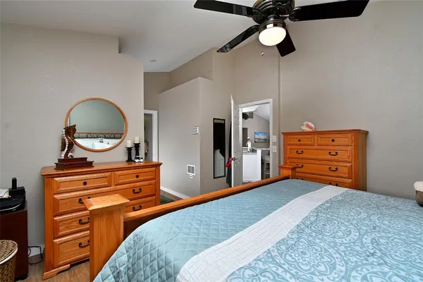 a bedroom with a bed and a dresser