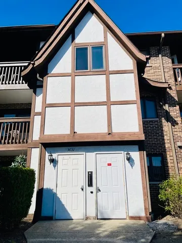 a front view of a house with a garage