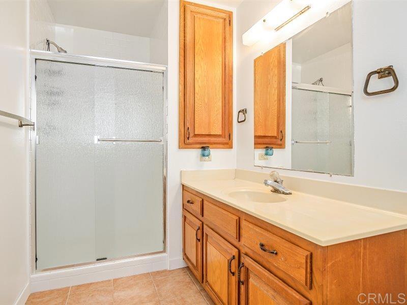 13913 Via De Jamul Jamul Ca Jamul, CA 91935 - Photo 36 of 67 a bathroom with a sink and a mirror